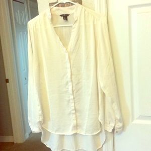 Cream colored dressy blouse.